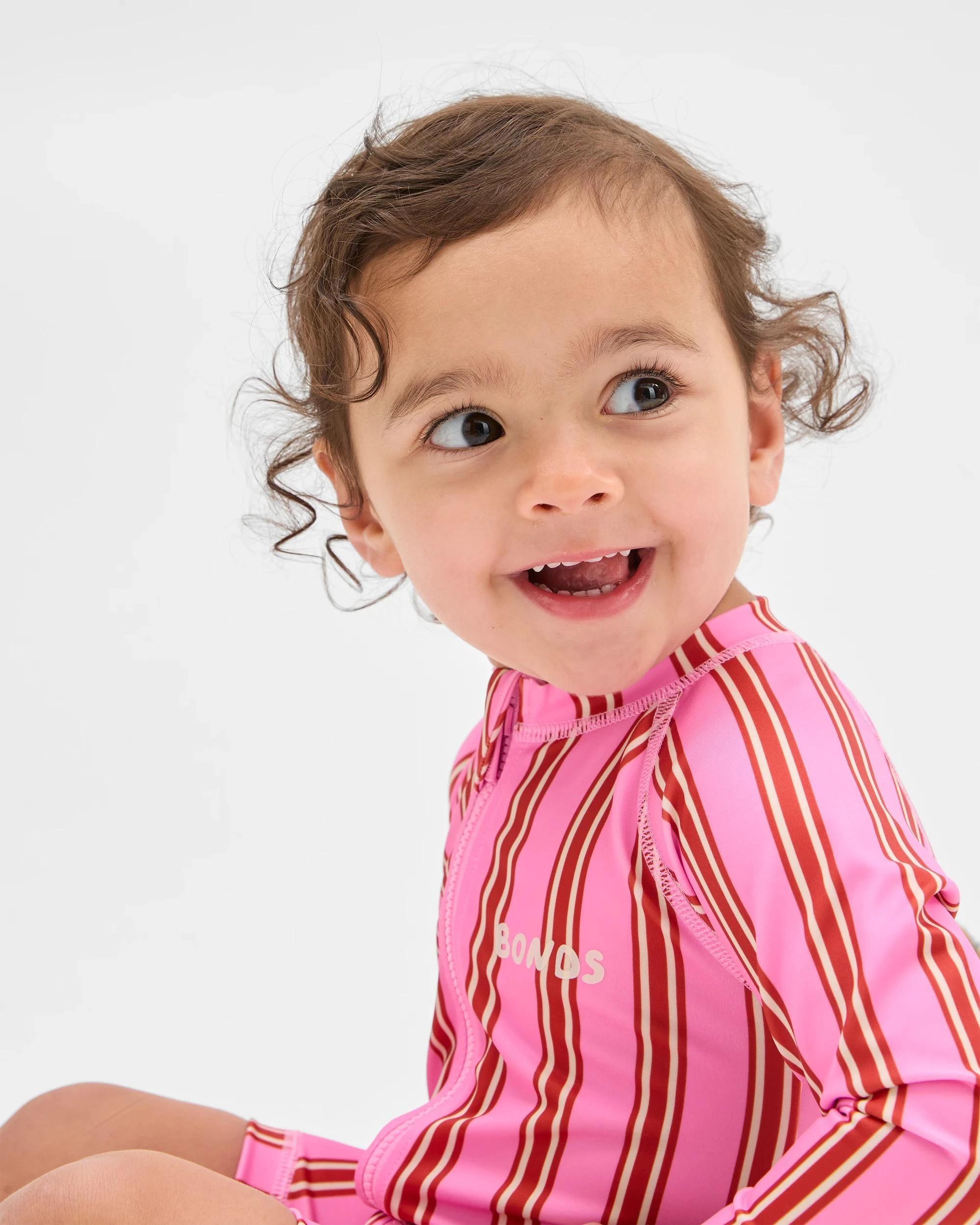 1 Bonds Baby Swim Zip Suit FUSHIA STRIPE, 1 of 3